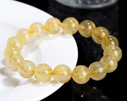 Healing crystal bracelet – golden rutilated quartz for focus, wealth, and balance