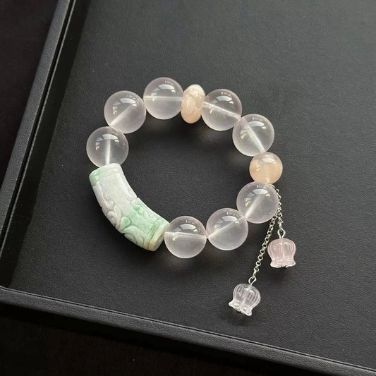 Healing crystal bracelet featuring Jade and Rose Quartz, with Sakura Agate for love, calmness, and emotional balance.