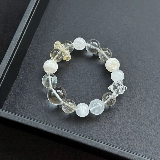 Healing crystal bracelet featuring Large Clear Quartz, Snowflake Phantom, and Gold Rutilated Quartz – supports clarity, abundance, and spiritual awakening.