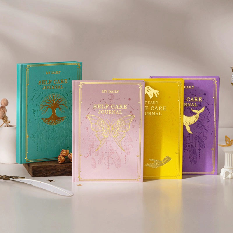 An aesthetic display of vintage spiritual mindfulness journals layered with natural raw crystals and healing gemstone home accessories.