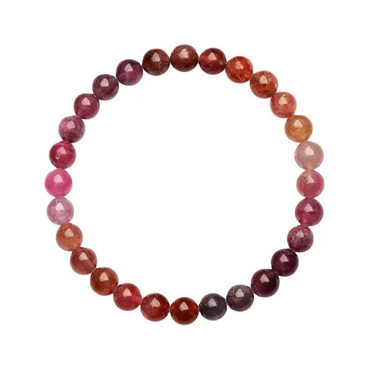 Multicolor spinel beaded bracelet with natural crystal beads in pink, red, and purple tones