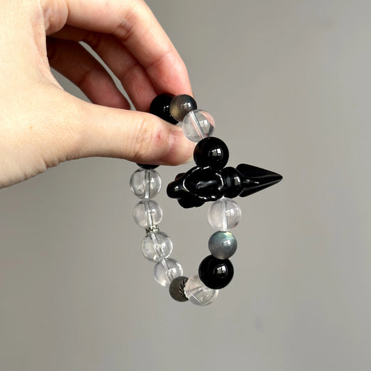 Beaded bracelet made with Obsidian, Grey Moonstone, Clear Quartz, and Black Agate – powerful stones for energy cleansing and focus.