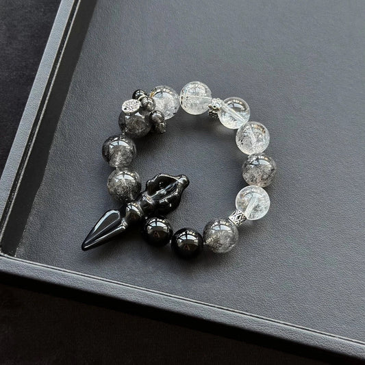 Healing crystal bracelet featuring Obsidian Vajra, Black Rutilated Quartz, and Clear Quartz – supports grounding, energy protection, and mental clarity.