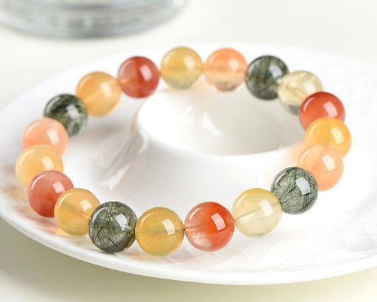 Beaded crystal bracelet made with rainbow rutilated quartz – crystal bracelet for energy, clarity, and manifestation