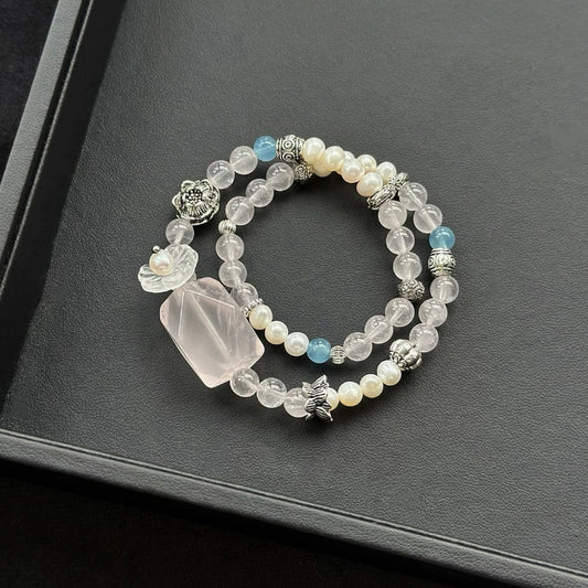 Healing crystal bracelet featuring Rose Quartz, Aquamarine, Clear Quartz, and Freshwater Pearl – perfect for love and emotional balance.