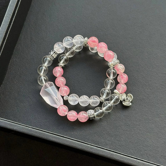 Healing crystal bracelet featuring Rose Quartz, Clear Quartz, and Rhodonite – ideal for love, clarity, and emotional healing.