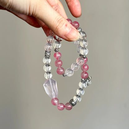 Beaded crystal bracelet made with Rose Quartz, Rhodonite, and Clear Quartz – promotes inner peace and emotional strength.