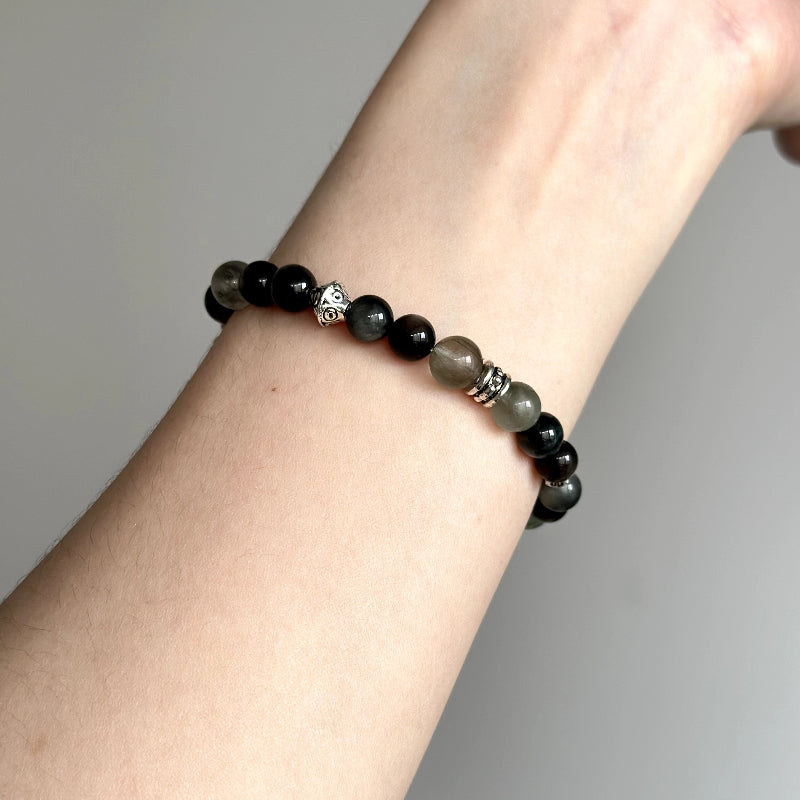 Bold beaded bracelet featuring Silver Obsidian, Hawk’s Eye, and Green Rutilated Quartz – healing jewelry for focus and energetic protection.