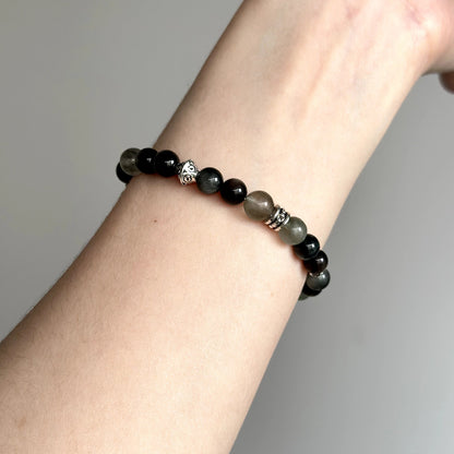 Bold beaded bracelet featuring Silver Obsidian, Hawk’s Eye, and Green Rutilated Quartz – healing jewelry for focus and energetic protection.