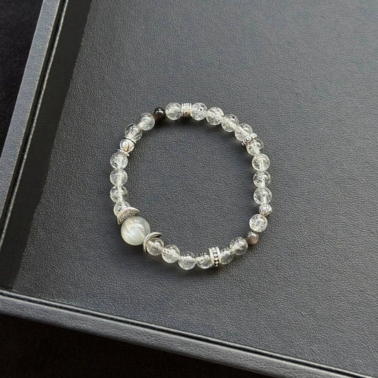 Healing crystal bracelet featuring Skeletal Moonstone, Black Mica, and Silver Obsidian – supports intuition, grounding, and energetic protection.