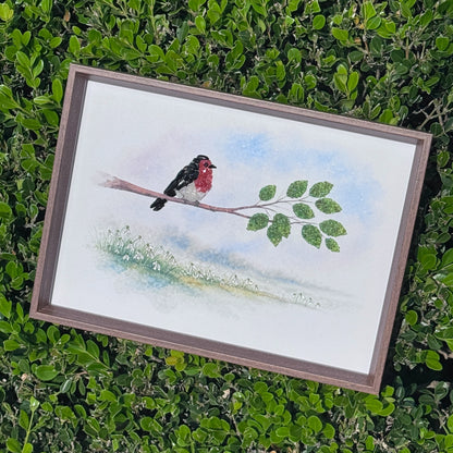 Elegant small space desk art featuring a crystal bird, placed in a modern garden setting.