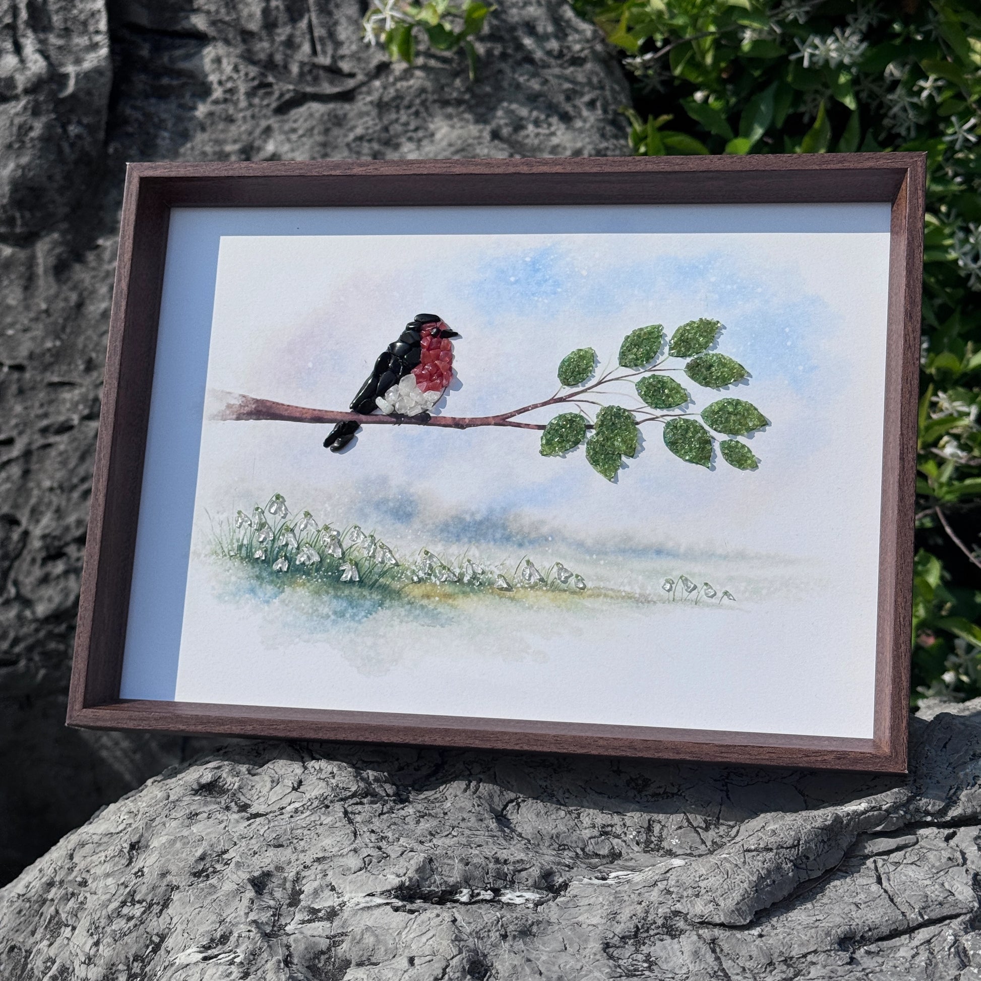Spiritual room aesthetics decor featuring a gemstone bird art on a natural stone surface.