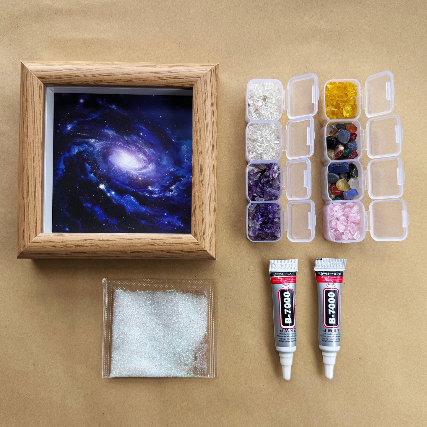 Flatlay of the Square Universe Crystal Art Kit including natural gemstones, frame, and glue.