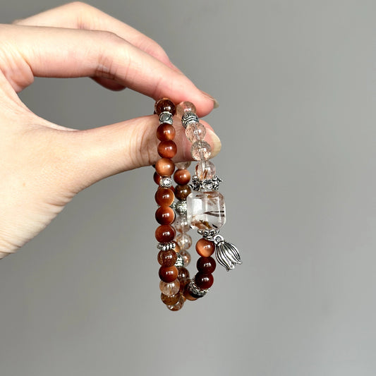 Crystal healing bracelet with Sun Tiger’s Eye and Super Seven – enhances willpower, protection, and focused intention.