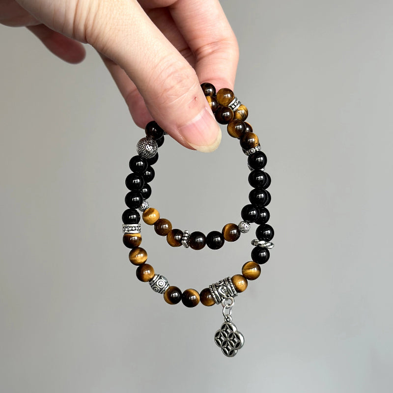Crystal healing bracelet with Tiger’s Eye and Black Agate – promotes strength, focus, and stability under stress.