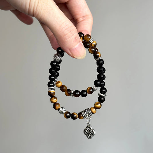 Crystal healing bracelet with Tiger’s Eye and Black Agate – promotes strength, focus, and stability under stress.