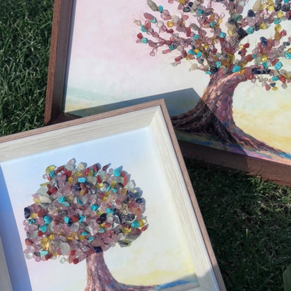 Comparison of A4 and 6-inch square Tree of Life crystal art frames on grass.