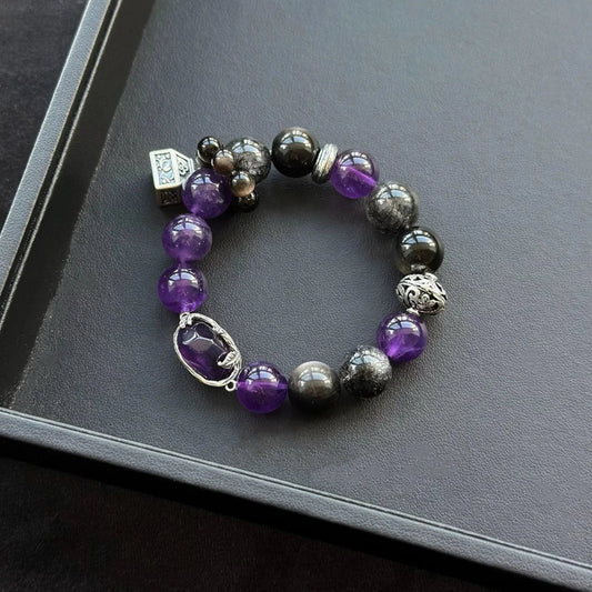 Healing crystal bracelet featuring Uruguayan Amethyst, Silver Obsidian, and Black Rutilated Quartz – supports protection, spiritual clarity, and inner strength.