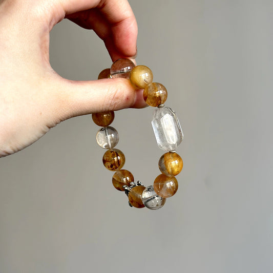 Beaded crystal bracelet with White Phantom and Yellow Hematite Quartz – handmade healing jewelry for grounding and balance.